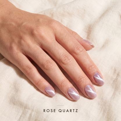 Rose Quartz — soft blush pearl with a silver cat eye streak